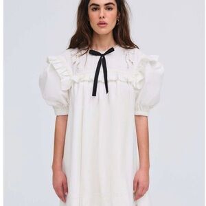 Elegant White Dress with Black Bow